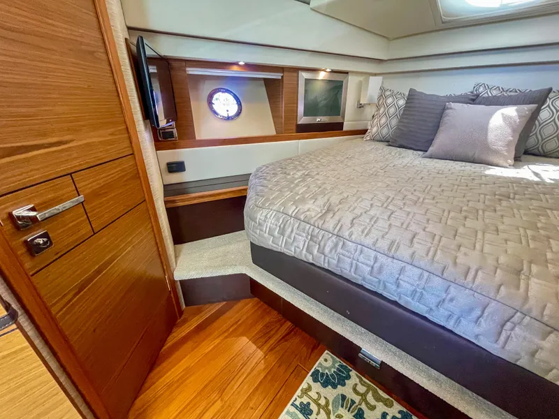 Slide: The Image of Luxurious bedroom interior of 2017 Tiara Yachts 44 Coupe with elegant wood finishes. - 32