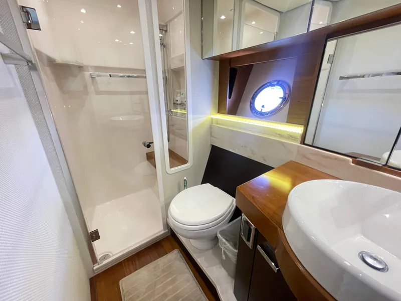 Slide: The Image of Luxurious bathroom in 2017 Tiara Yachts 44 Coupe with modern fixtures and porthole window. - 33