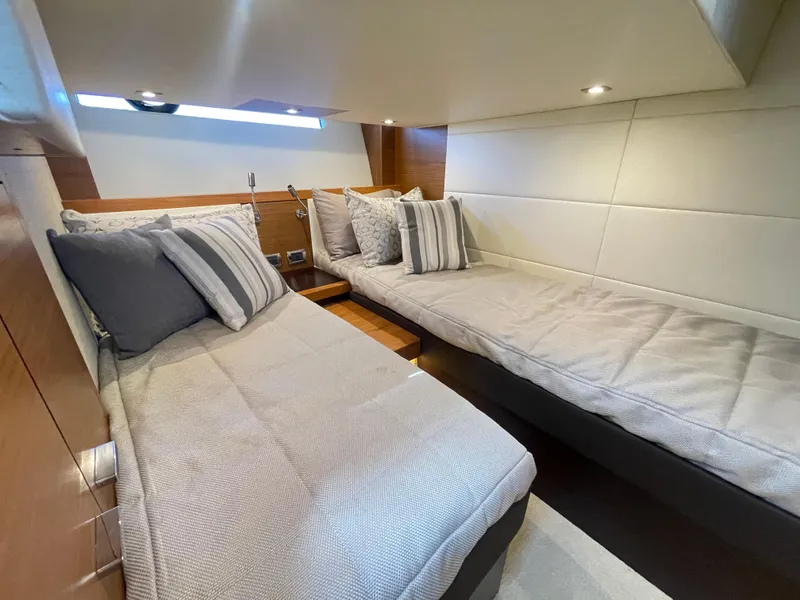 Slide: The Image of Luxurious twin cabin interior of 2017 Tiara Yachts 44 Coupe with modern decor. - 34