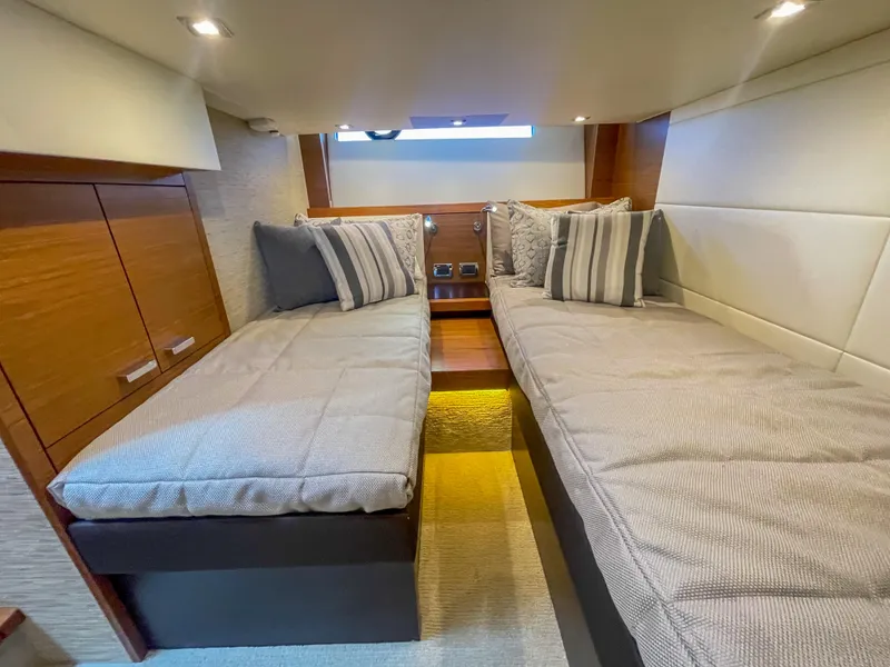 Slide: The Image of Luxurious cabin interior of 2017 Tiara Yachts 44 Coupe with twin beds and elegant decor. - 35