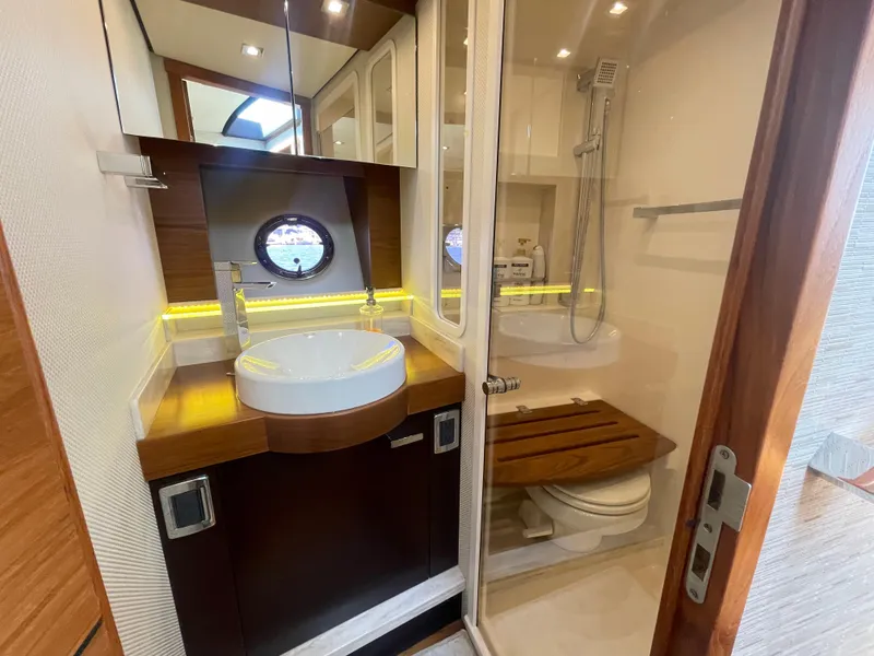 Slide: The Image of Luxurious bathroom in 2017 Tiara Yachts 44 Coupe, featuring modern fixtures and elegant design. - 38