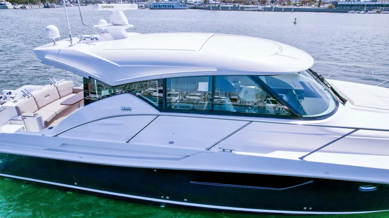 Slide: The Image of 2017 Tiara Yachts 44 Coupe on water, sleek design, luxury boat. - 9