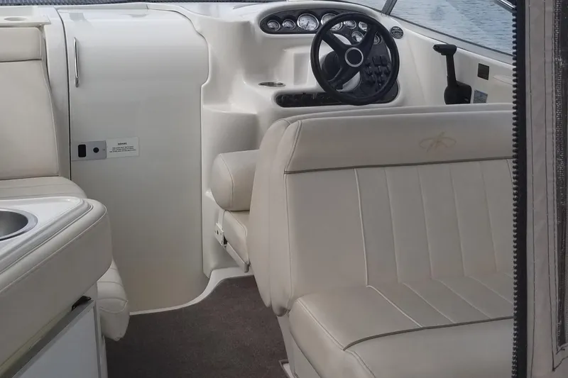 Slide: The Image of 2001 Monterey 262 Cruiser boat named "Imagine" docked at a marina. - 7