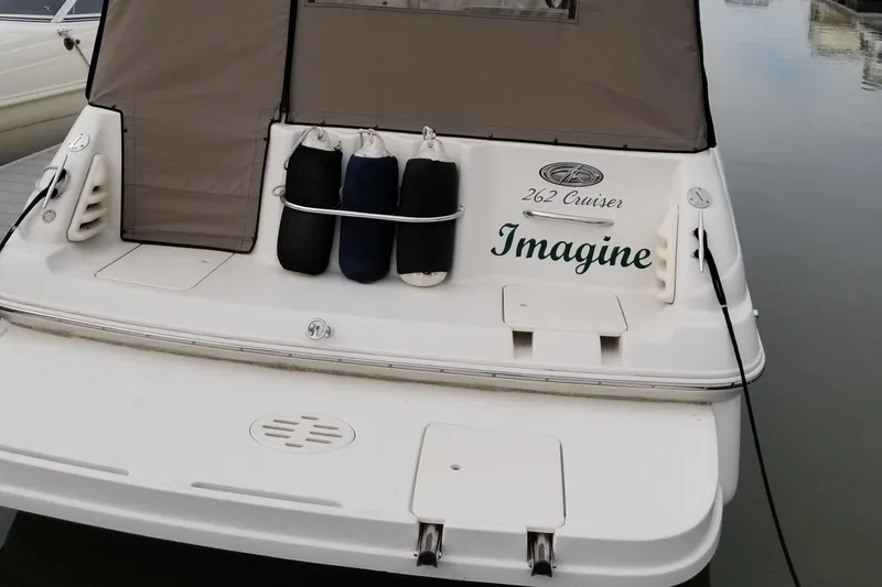 Slide: The Image of 2001 Monterey 262 Cruiser interior with beige seating and steering console. - 8