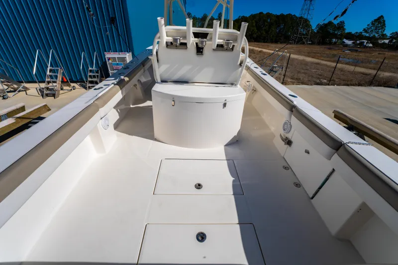 Slide: The Image of 2019 Regulator 34 boat deck with seating and storage compartments. - 11