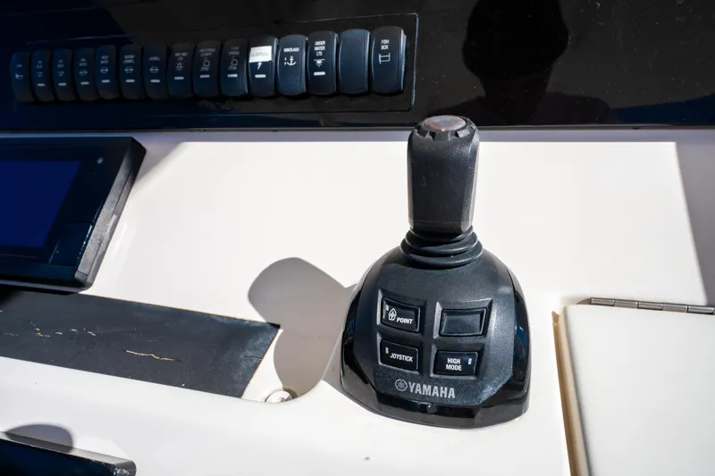 Slide: The Image of Joystick control on 2019 Regulator 34 boat dashboard, featuring Yamaha branding. - 14
