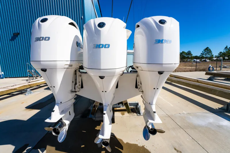 Slide: The Image of Triple 300 horsepower outboard engines on a 2019 Regulator 34 boat. - 4