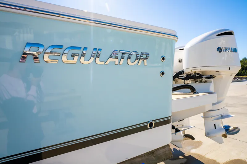 Slide: The Image of 2019 Regulator 34 boat with Yamaha outboard motor, side view. - 7