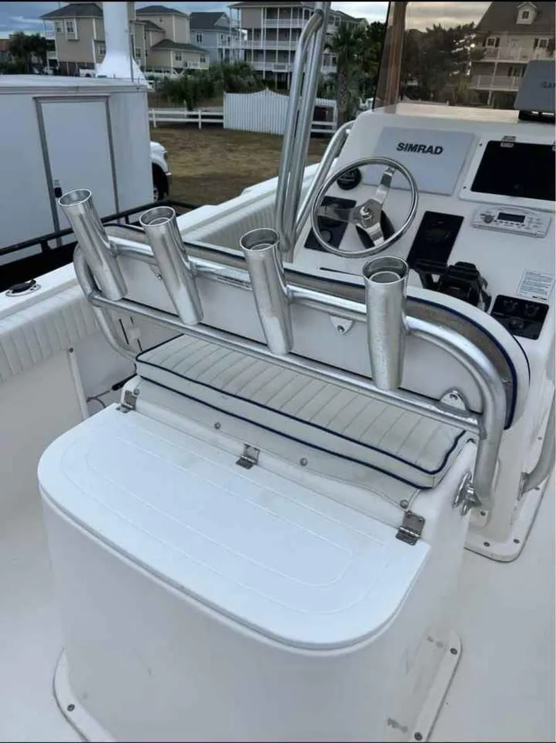 Slide: The Image of 2008 Clearwater 2500 boat console with rod holders and Simrad navigation system. - 5