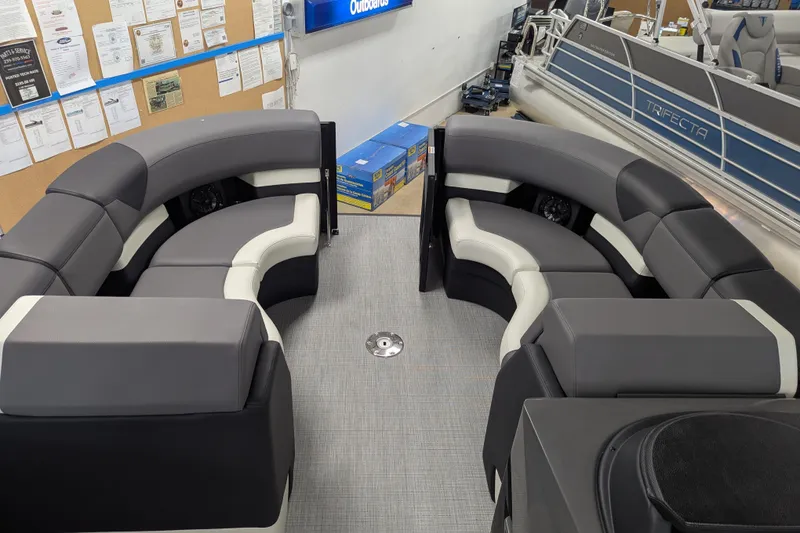 Slide: The Image of 2026 Trifecta 23UL SS ARCH pontoon boat interior with gray seating and modern design. - 10