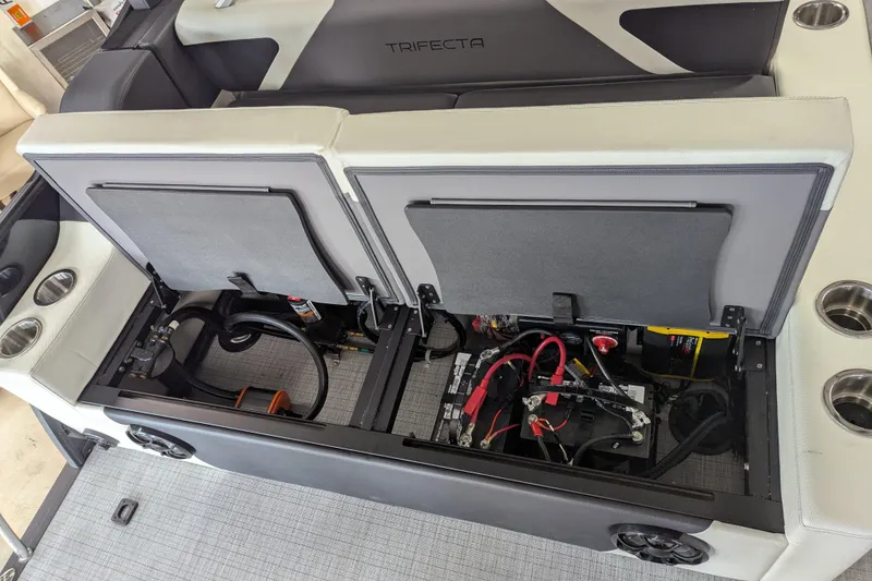 Slide: The Image of 2026 Trifecta 23UL SS ARCH boat interior showing open storage compartments and wiring. - 12