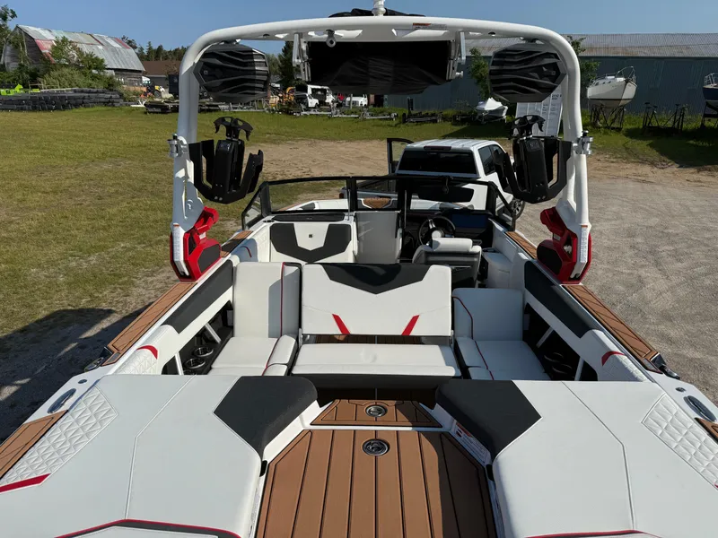 Slide: The Image of 2025 Nautique Super Air Nautique GS22 interior with sleek seating and advanced audio system. - 10