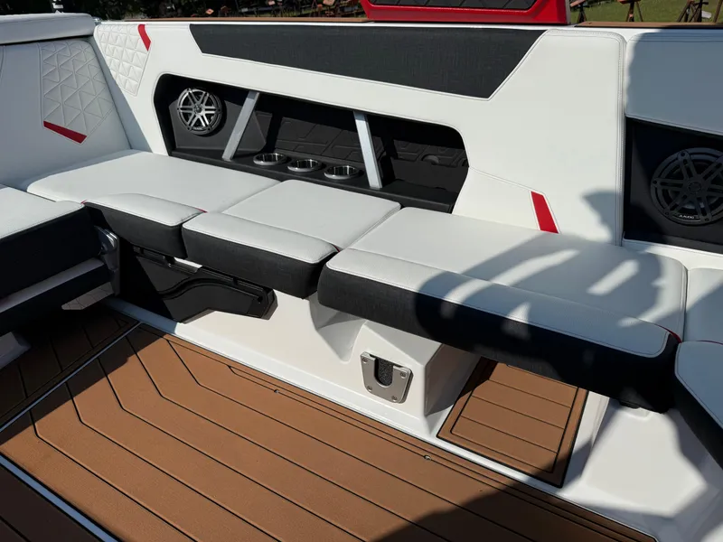 Slide: The Image of 2025 Nautique Super Air Nautique GS22 interior with white seating and modern design. - 13