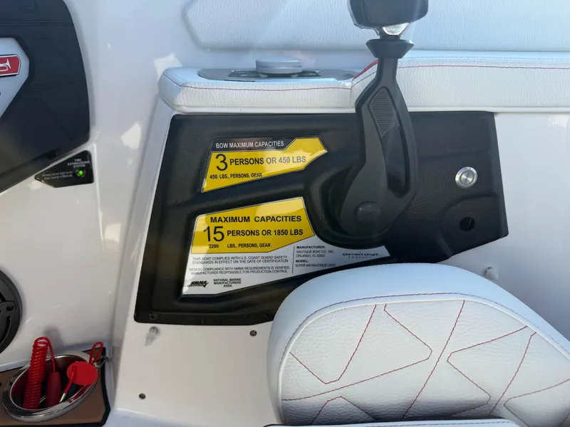 Slide: The Image of 2025 Nautique Super Air Nautique GS22 capacity labels, showing maximum person and weight limits. - 18