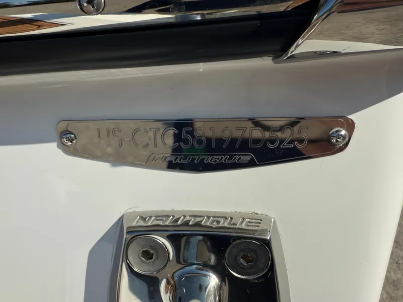Slide: The Image of 2025 Nautique Super Air Nautique GS22 hull identification number plate. - 21