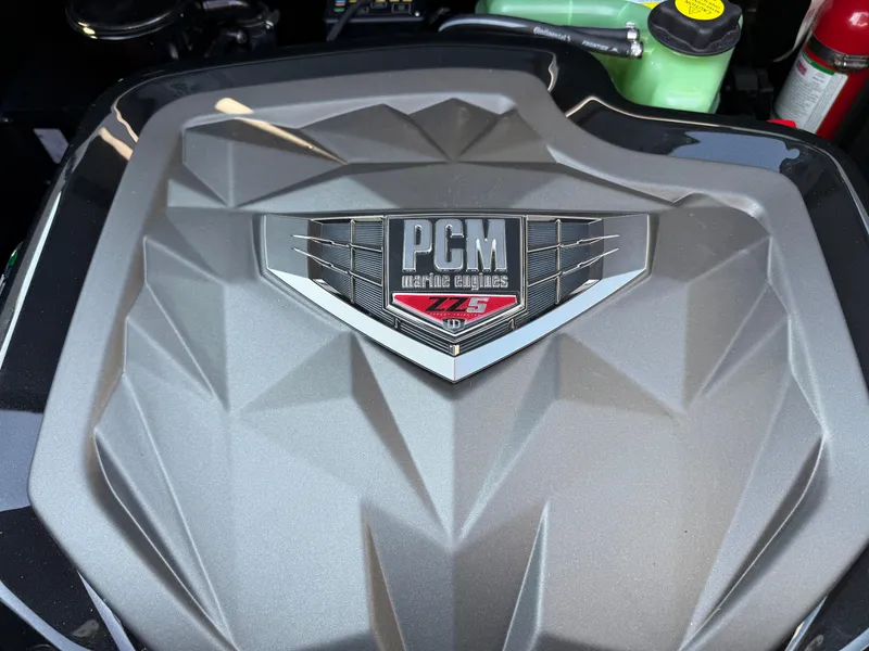 Slide: The Image of Engine cover of 2025 Nautique Super Air Nautique GS22 with PCM ZR5 logo. - 22