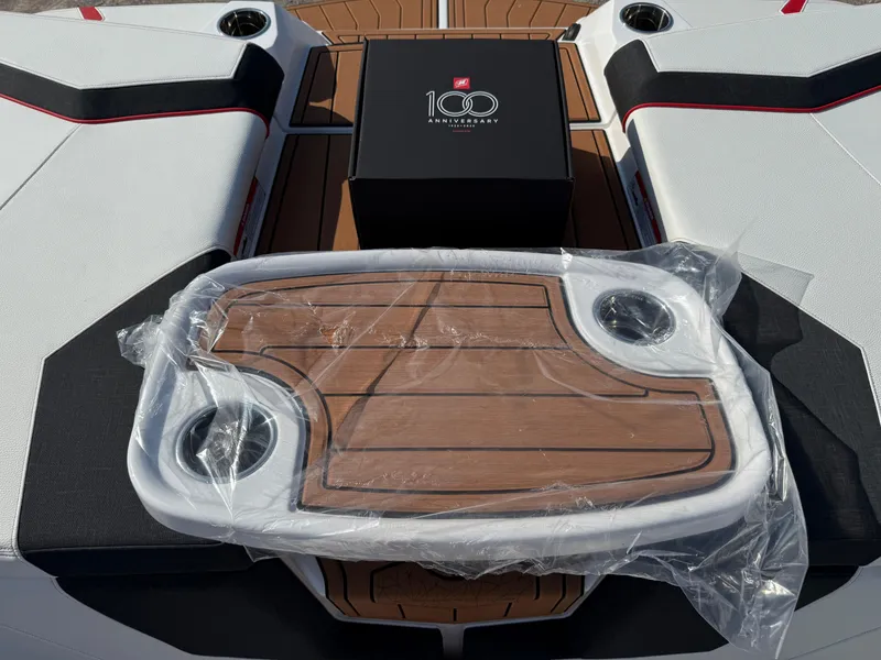 Slide: The Image of 2025 Nautique Super Air Nautique GS22 with 100th anniversary box and packaged table on deck. - 23