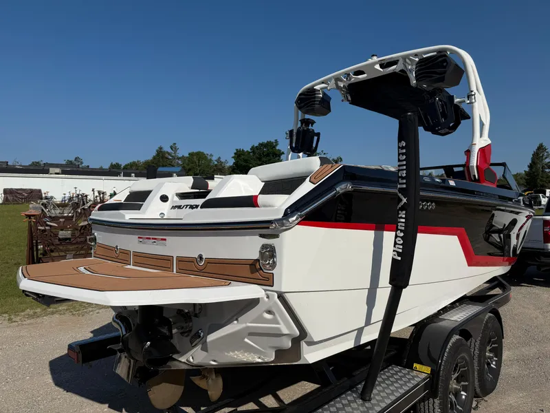 Slide: The Image of 2025 Nautique Super Air Nautique GS22 boat on trailer, featuring sleek design and modern features. - 5