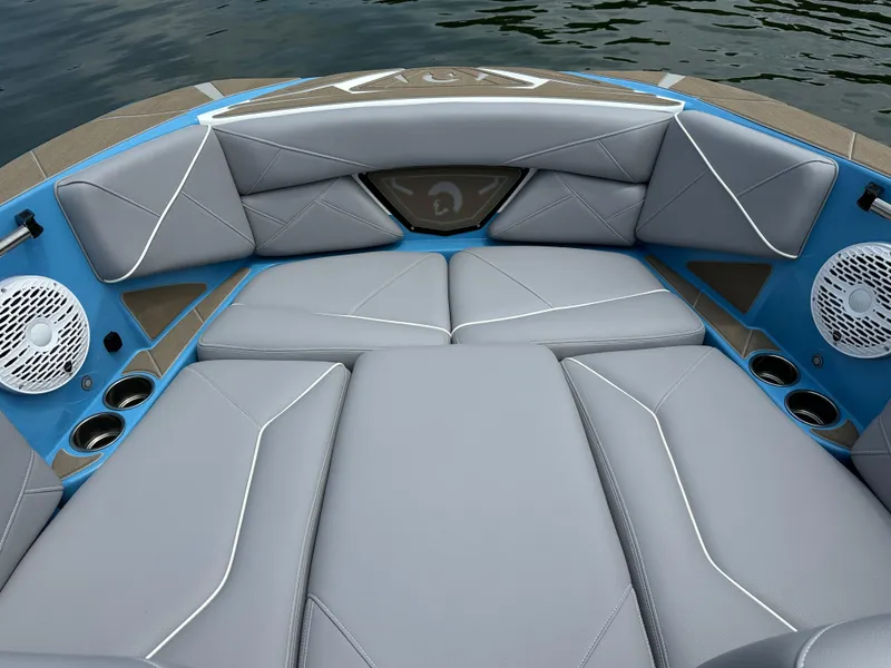 Slide: The Image of Luxurious interior of 2025 Centurion NV233 boat with gray seating and speakers. - 11