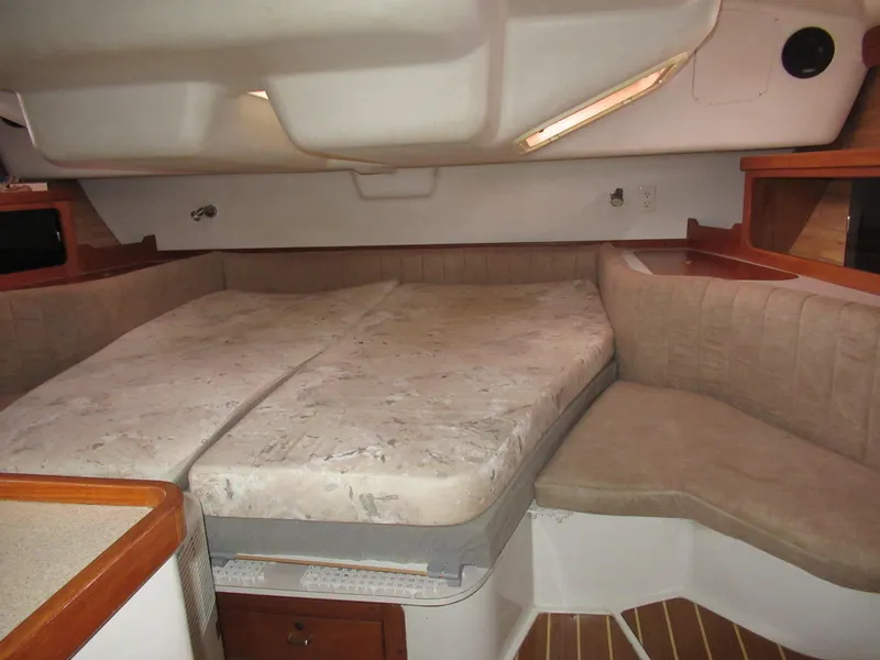 Slide: The Image of Interior cabin of a 1995 Catalina 400 sailboat with a spacious bed. - 15
