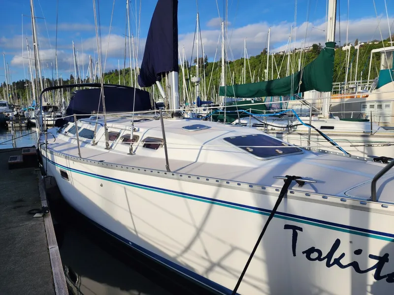 Slide: The Image of Catalina 400 sailboat docked at marina, 1995 model, with clear blue sky. - 2