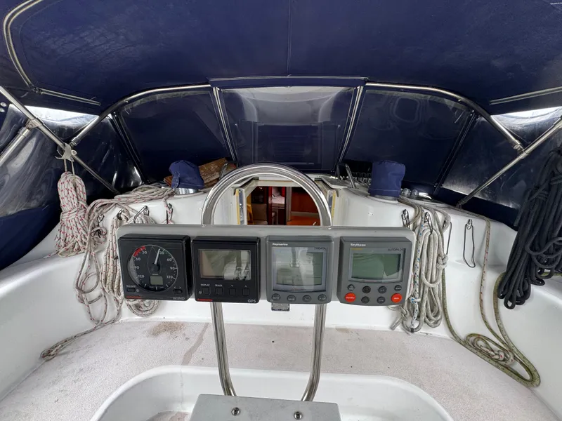 Slide: The Image of Cockpit of a 1995 Catalina 400 sailboat with navigation instruments and ropes. - 30