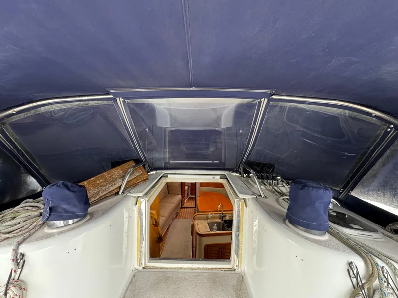 Slide: The Image of Interior view of a 1995 Catalina 400 sailboat, showcasing the cabin entrance. - 36
