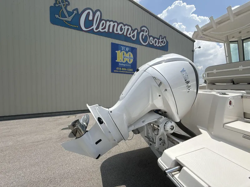 Slide: The Image of 2025 Sailfish 232 CC boat with Yamaha outboard at Clemons Boats dealership. - 5