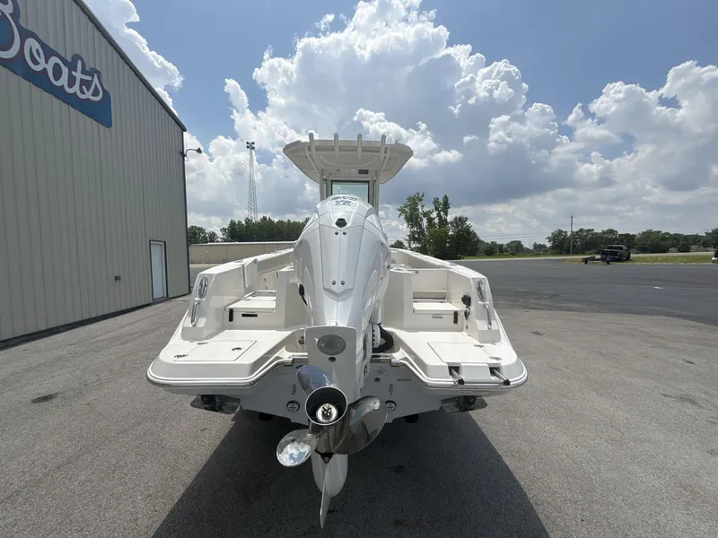 Slide: The Image of 2025 Sailfish 232 CC boat rear view under cloudy sky. - 6