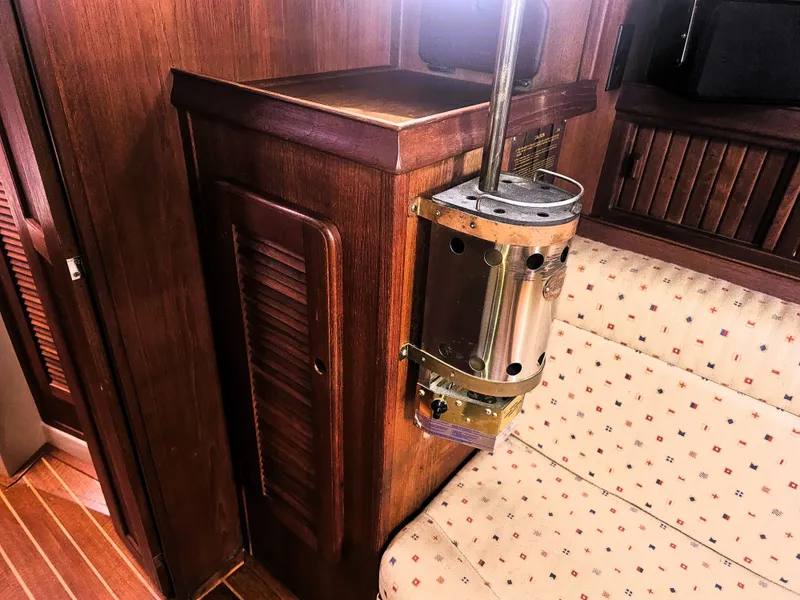 Slide: The Image of Interior of 1990 Island Packet 35 sailboat with wood paneling and seating. - 10