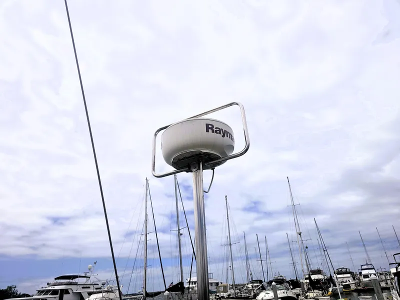 Slide: The Image of Radar on Island Packet 35 sailboat, 1990 model, with marina and cloudy sky background. - 23