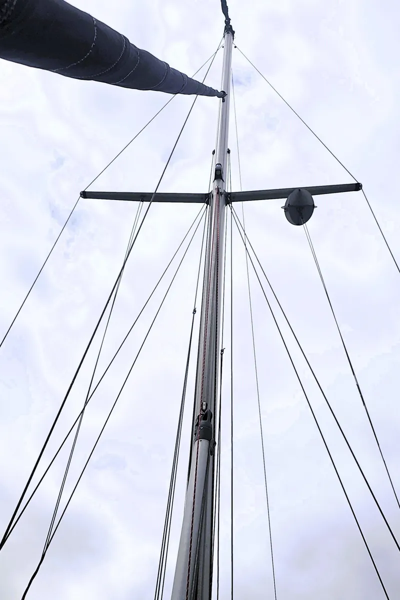 Slide: The Image of Mast of 1990 Island Packet 35 sailboat against cloudy sky. - 28
