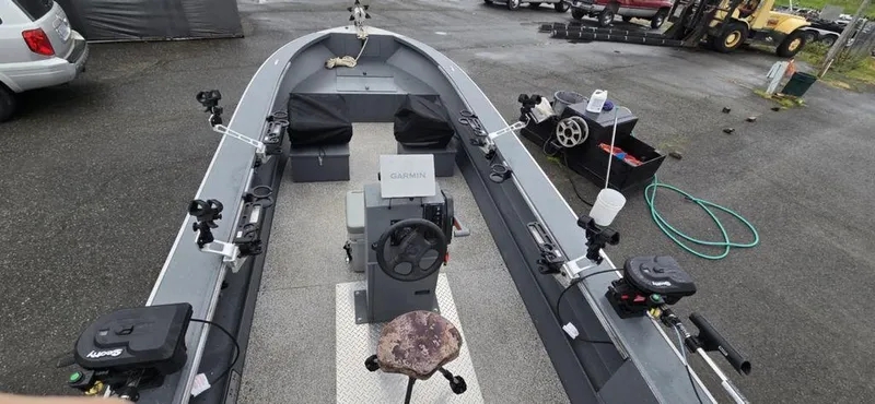 Slide: The Image of 2019 Alumaweld 20 Adventure boat interior with fishing gear and steering console. - 11