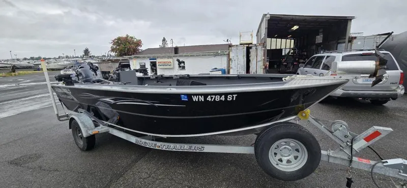 Slide: The Image of 2019 Alumaweld 20 Adventure boat on trailer in parking lot. - 2
