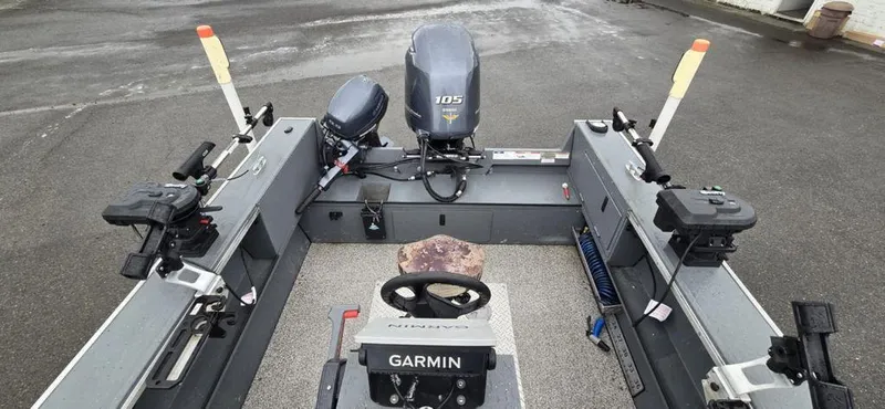 Slide: The Image of 2019 Alumaweld 20 Adventure boat interior with Garmin equipment and dual motors. - 9