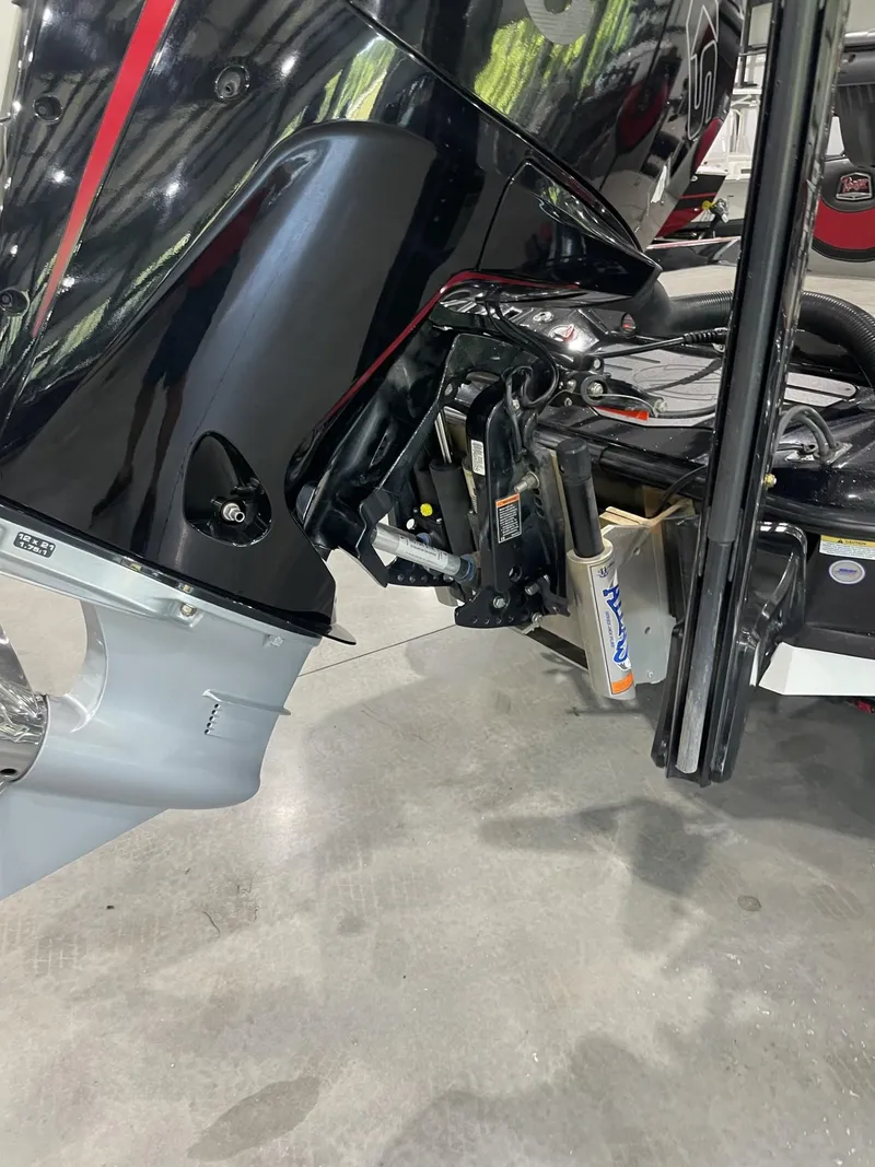 Slide: The Image of 2021 Ranger Z521L boat motor and propeller detail in showroom setting. - 3