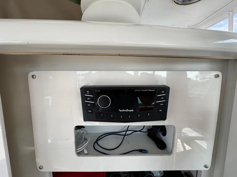 Slide: The Image of Carver 504 Cockpit Motor Yacht 2000 stereo system with storage compartment. - 13