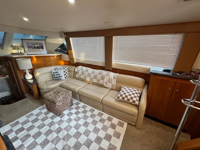 Slide: The Image of Luxurious interior of 2000 Carver 504 Cockpit Motor Yacht with cozy seating and stylish decor. - 23