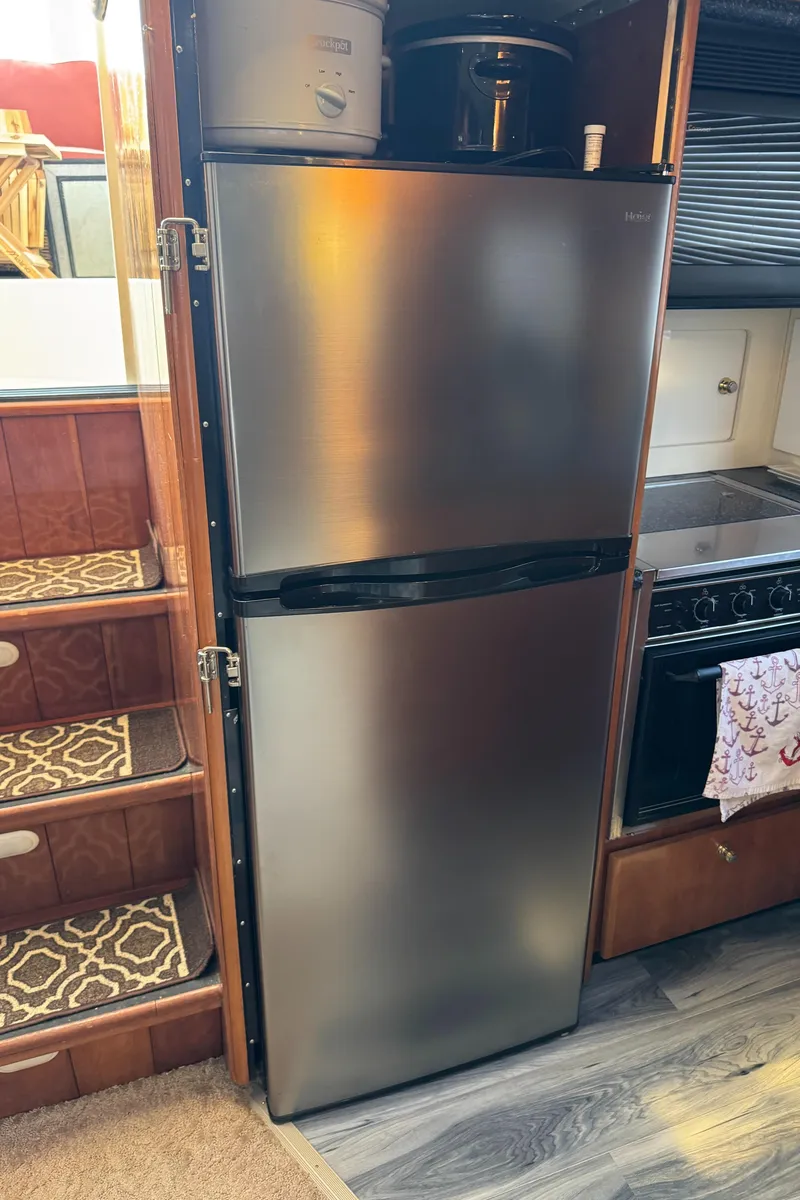 Slide: The Image of Stainless steel refrigerator in a 2000 Carver 504 Cockpit Motor Yacht kitchen. - 28
