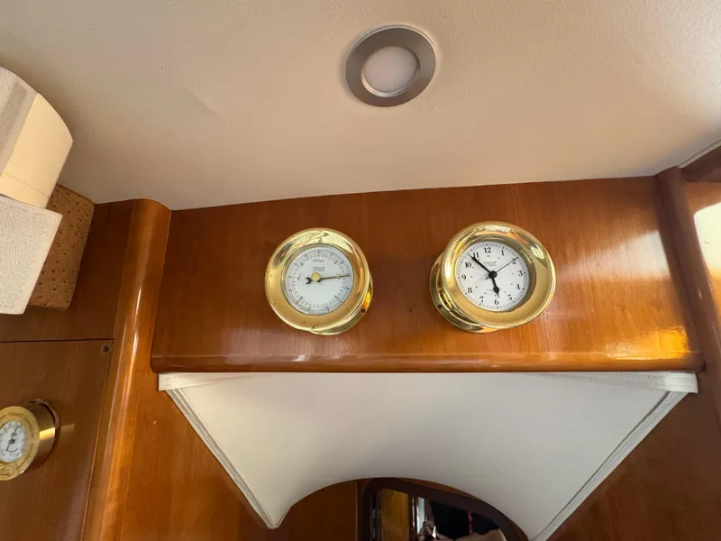 Slide: The Image of Interior of 2000 Carver 504 Cockpit Motor Yacht with brass clock and barometer. - 29