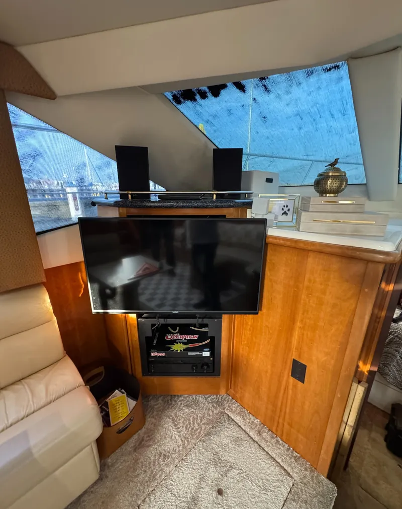 Slide: The Image of Interior of 2000 Carver 504 Cockpit Motor Yacht with TV and audio system. - 31