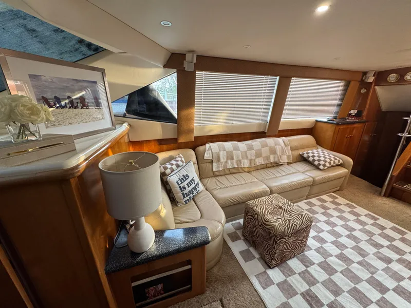 Slide: The Image of Luxurious interior of 2000 Carver 504 Cockpit Motor Yacht with cozy seating and decor. - 37