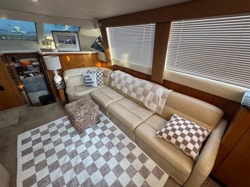 Slide: The Image of Luxurious interior of 2000 Carver 504 Cockpit Motor Yacht with cozy seating and decor. - 39