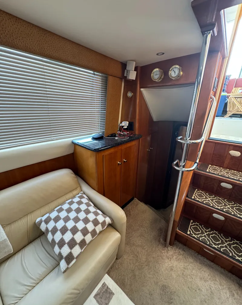 Slide: The Image of Interior of 2000 Carver 504 Cockpit Motor Yacht with stairs and seating area. - 40