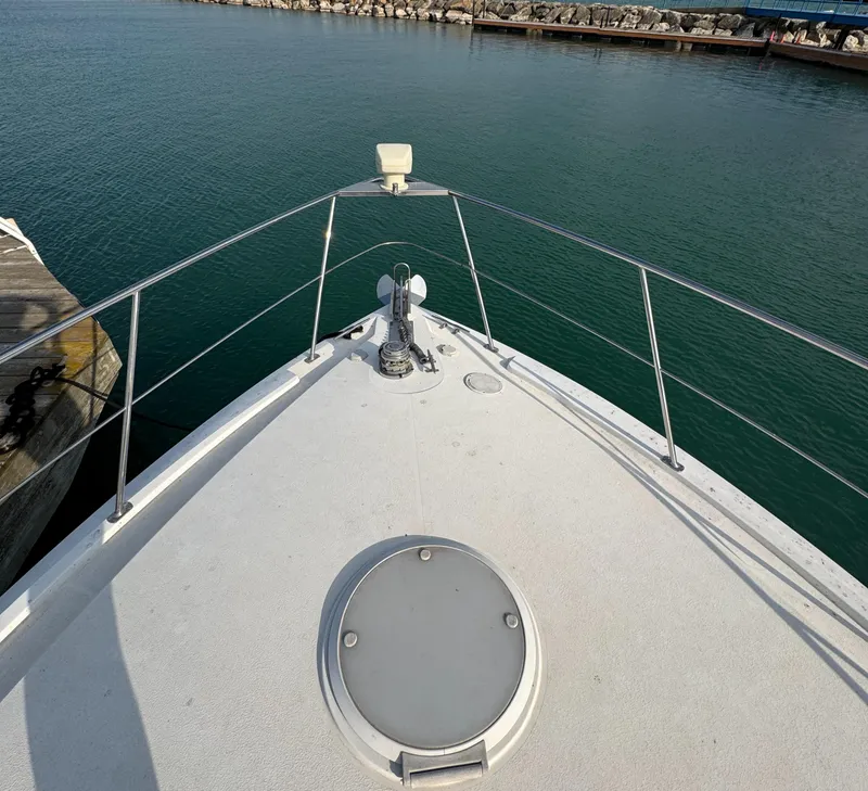 Slide: The Image of Bow view of 2000 Carver 504 Cockpit Motor Yacht at dock. - 9