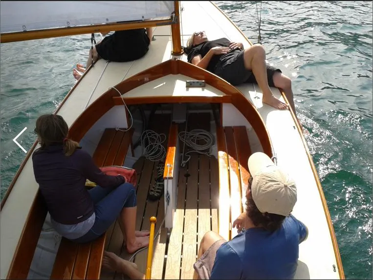 Slide: The Image of People relaxing on a 1995 Herreshoff Watch Hill 15 sailboat. - 5