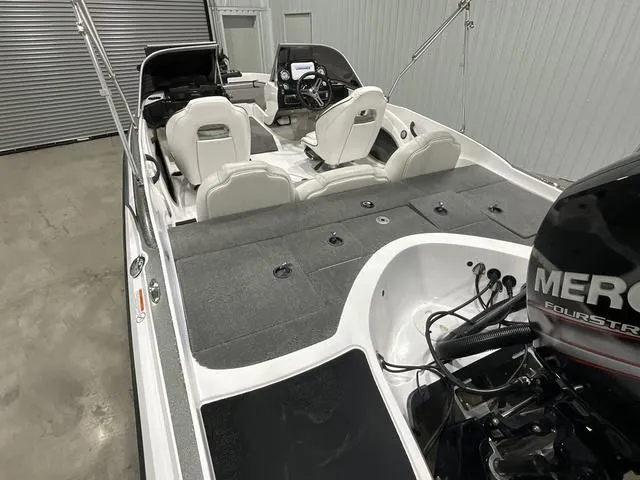 Slide: The Image of 2019 Nitro Z19 Sport boat interior with Mercury engine in a garage. - 10