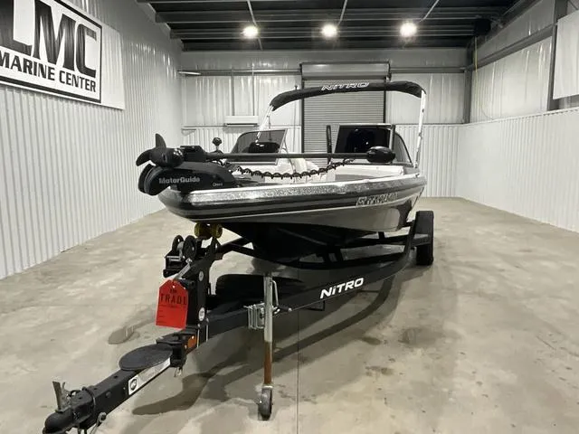 Slide: The Image of 2019 Nitro Z19 Sport boat on trailer in indoor showroom. - 2