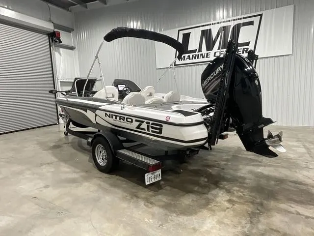 Slide: The Image of 2019 Nitro Z19 Sport boat in showroom, featuring Mercury outboard motor. - 3