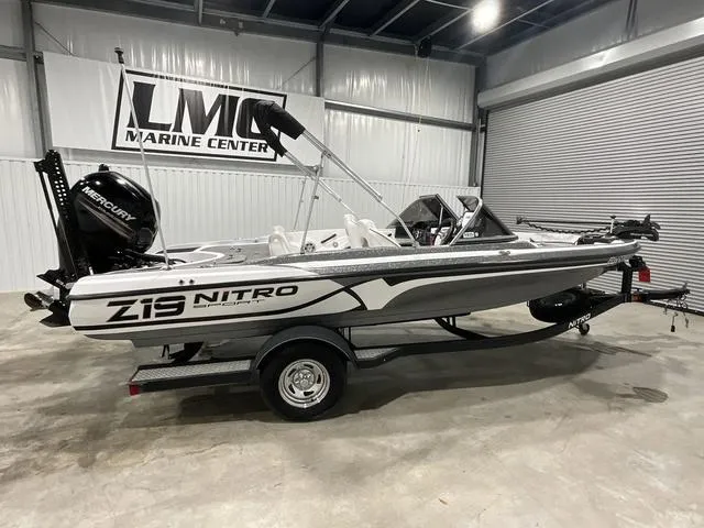 Slide: The Image of 2019 Nitro Z19 Sport boat in showroom, featuring Mercury engine and sleek design. - 4